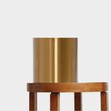 Striking Laiton Brass Plant Pot on a timber table