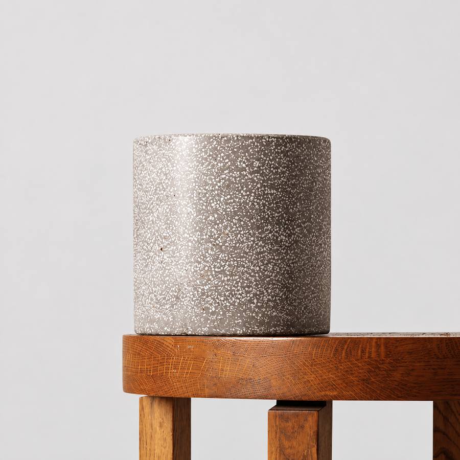 Jardin grey terrazzo pot on a timber table against a soft grey background.