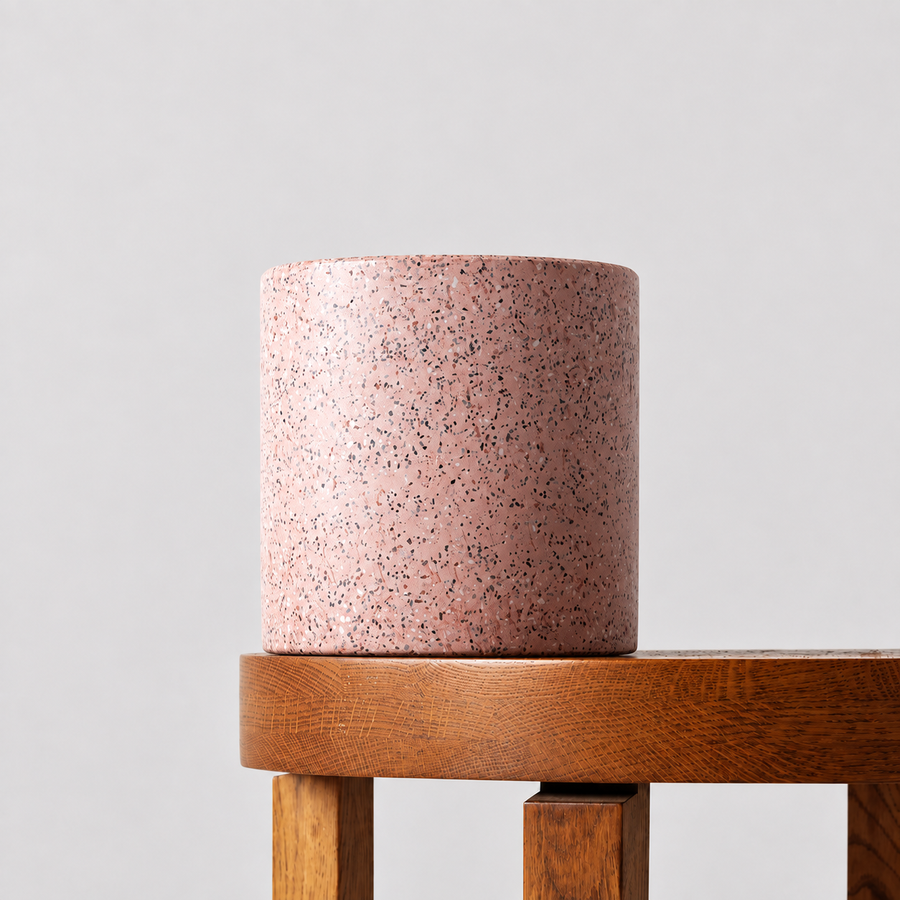 Jardin pink terrazzo pot on a timber table against a soft grey background.